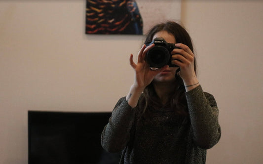 a lifestyle blogger with a camera wondering if AI means the end of the blogging era