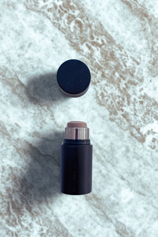 Product shot of the Westman Atelier Face Trace Contour Stick in 'Biscuit', showing the creamy texture and luxury packaging for an honest product review.