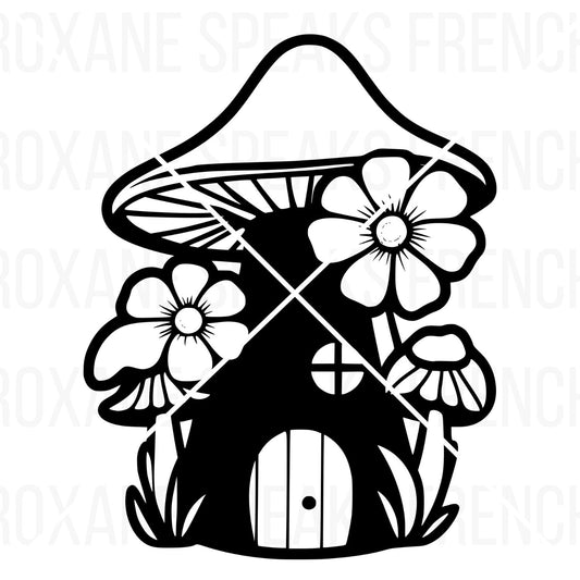 Black and white silhouette of a vinyl fairy house svg designed as a mushroom. The mushroom cap features intricate lines and patterns, with large flowers flanking the stem on which a small, round door and two circular windows are placed. The design is intended for use in SVG format for crafts and decorations, branded with 'Roxane Speaks French' across the image