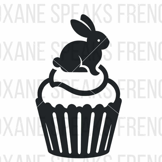 A charming black and white silhouette illustration of a bunny sitting on top of a cupcake. The design features clean, minimalistic lines, capturing the playful and festive feel of the bunny and cupcake combination.